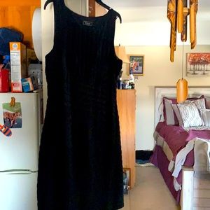 A beautiful like brand new, sleeveless Black Dress.